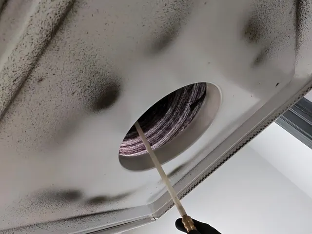 Dust and soot on a supply vent before cleaning