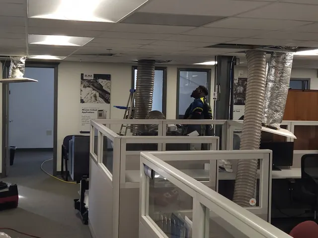 Cleaning the ducts above an office cubicle floor