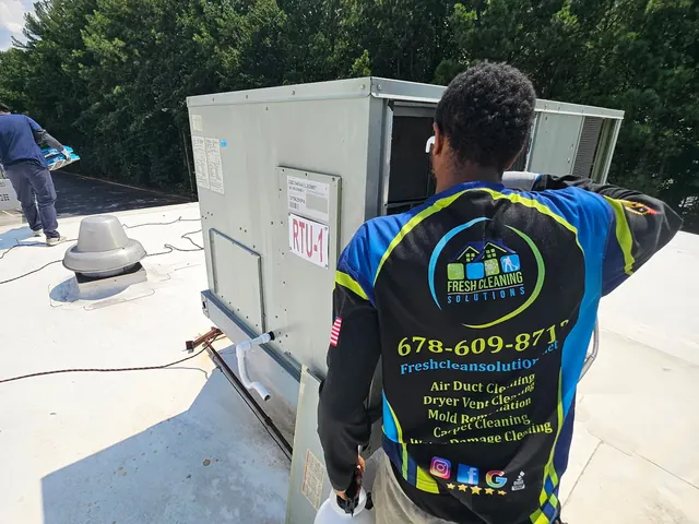 Our tech at a commercial rooftop HVAC unit