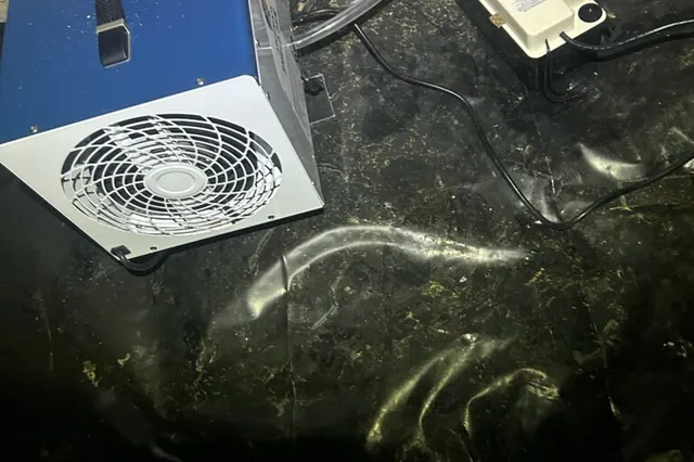 Air scrubber running on a crawl space vapor barrier