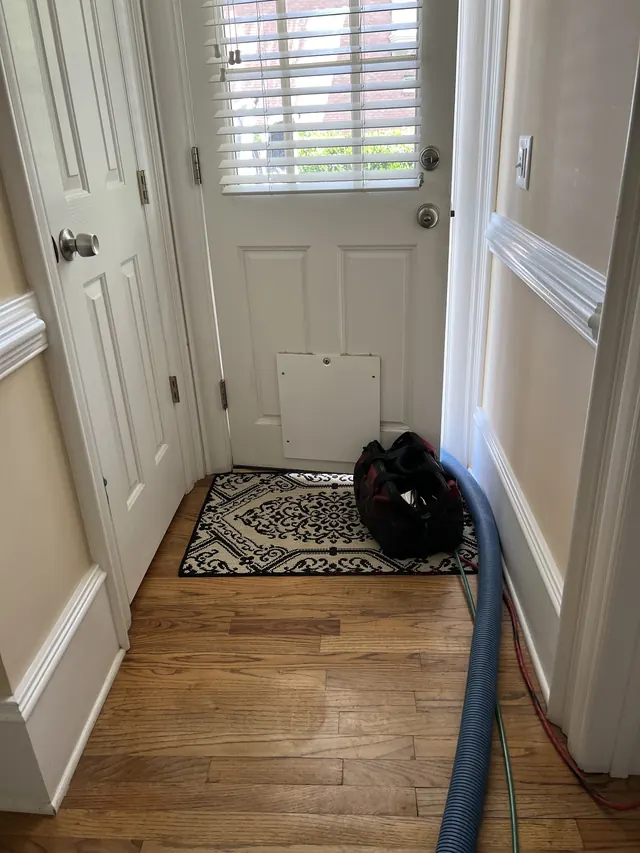 Duct cleaning hose run in through the front door
