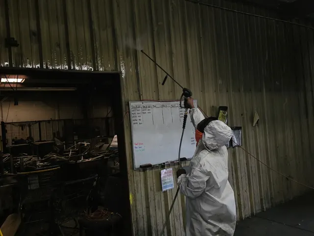 Spraying treatment in a commercial building during mold remediation